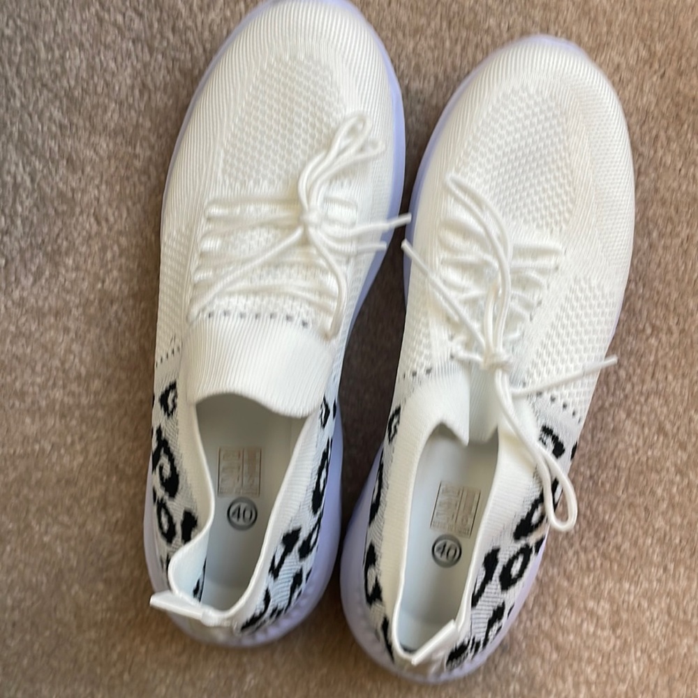 White print slip on sneakers